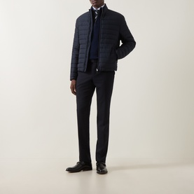 Model wearing Canali navy quilted casual jacket, styled with navy knitwear, trousers and black leather shoes