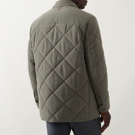 Model wearing Canali Diamond Quilted Field Jacket in green, rear view showing diamond quilt pattern and snap button cuffs.