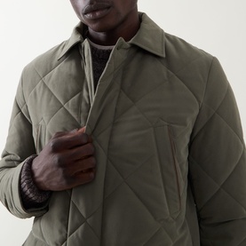 Model wearing Canali Diamond Quilted Field Jacket in green, showing diamond quilting detail, pointed collar and chest pocket close-up.