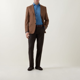 Model wearing Canali light blue cotton-linen casual shirt, styled with brown blazer and dark trousers