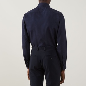 Model wearing Canali Flannel Herringbone Shirt in navy, back view, paired with navy trousers. Long sleeves, buttoned cuffs, curved hem.