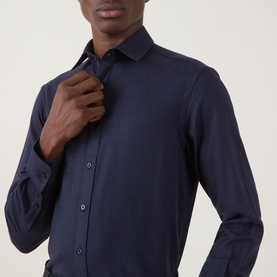 Model wearing Canali Flannel Herringbone Shirt in navy, featuring point collar, front button fastening and long sleeves, shown in close-up detail.