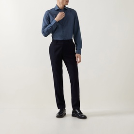 Model wearing Canali blue cotton-lyocell casual shirt, styled with black tailored trousers and black leather loafers.