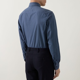 Model wearing Canali blue casual shirt in cotton-lyocell blend, rear view, styled with navy trousers