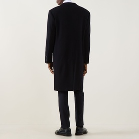Model wearing Canali Classic Single-Breasted Overcoat in navy wool-cashmere, longline cut with rear vent, styled with dark trousers and black shoes.