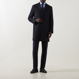 Model wearing Canali navy wool coat, styled with matching navy suit trousers and black leather shoes, light blue shirt visible at collar.