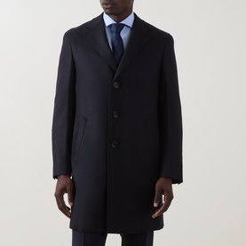 Model wearing Canali navy wool overcoat with three-button front, styled with light blue shirt and navy tie.