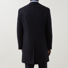 Model wearing Canali navy wool coat, back view, styled with light blue shirt and dark trousers
