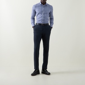 Model wearing Canali blue cotton check casual shirt, styled with navy tailored trousers and black leather shoes.