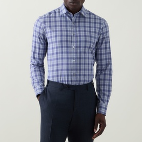 Model wearing Canali blue large check cotton casual shirt, styled with navy tailored trousers
