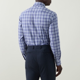 Model wearing Canali blue cotton check casual shirt, back view, styled with navy tailored trousers