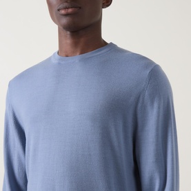 Model wearing Canali Fine-Knit Sweater in light blue, crew neck with ribbed trims and fine-knit construction, close-up detail view.