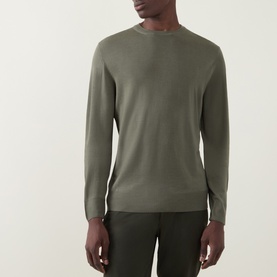 Model wearing Canali Fine-Knit Sweater in green, crew neck with long sleeves and ribbed trims, styled with dark trousers.