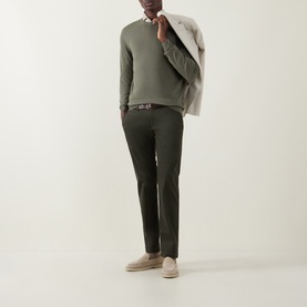 Model wearing Canali Green Fine-Knit Crew Neck Sweater, styled with dark olive trousers, brown belt, and beige suede loafers.