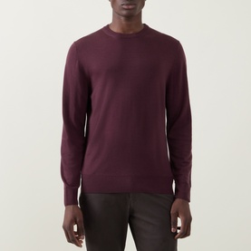 Model wearing Canali Fine-Knit Sweater in burgundy wool, crew neck with ribbed trims, paired with dark trousers.