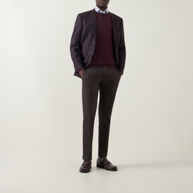 Model wearing Canali Fine-Knit Sweater in burgundy crew neck, styled with dark blazer, brown trousers and loafers.