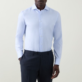 Model wearing Canali blue cotton double cuff regular formal shirt with spread collar, styled with navy trousers