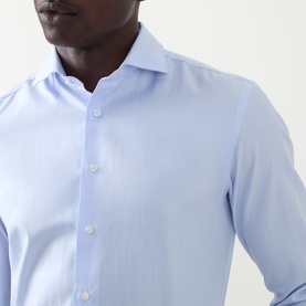 Model wearing Canali Blue Double Cuff Regular formal shirt in 100% cotton, close-up showing spread collar and button placket.