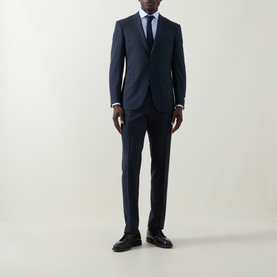Model wearing Canali blue double cuff regular cotton formal shirt, styled with navy suit and black leather shoes.