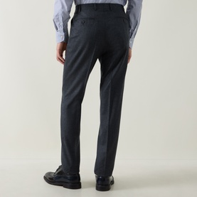 Model wearing Canali charcoal wool formal trousers, rear view, styled with a light blue shirt and black leather shoes.
