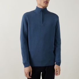 Model wearing Canali blue wool half-zip jumper with ribbed collar and long sleeves, styled with black trousers