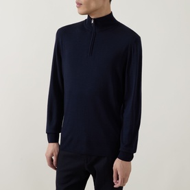 Model wearing Canali navy wool half-zip knit with mock neck collar and ribbed cuffs, paired with navy trousers