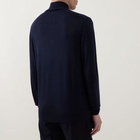 Model wearing Canali Navy Half Zip knit, back view, with navy trousers. Fine wool fabric, ribbed cuffs and hem.