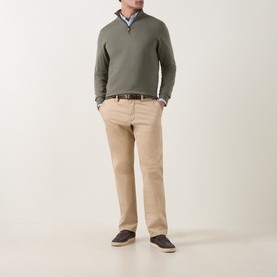Model wearing Canali Merino Half-Zip Sweater in green with beige chinos, a check shirt, brown belt, and dark navy loafers.