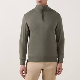 Model wearing Canali Merino Half-Zip Sweater in green, fine knit with funnel neck and half-zip, styled with beige trousers.
