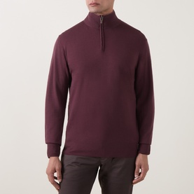 Model wearing Canali Merino Half-Zip Sweater in burgundy, funnel neck, half-zip fastening, slim fit, paired with dark trousers.