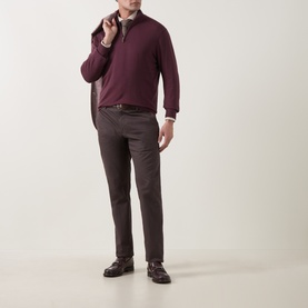 Model wearing Canali Merino Half-Zip Sweater in burgundy with dark trousers and brown loafers.