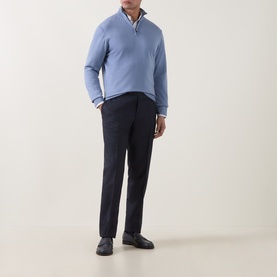 Model wearing Canali Light Blue Merino Half-Zip Sweater with navy trousers and dark loafers.