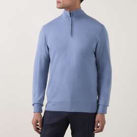 Model wearing Canali Merino Half-Zip Sweater in light blue, fine knit with funnel neck and half-zip, styled with dark trousers.