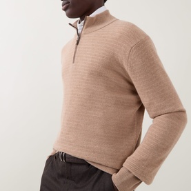 Model wearing Canali camel wool-cashmere half-zip knit, styled with a white shirt and dark trousers.