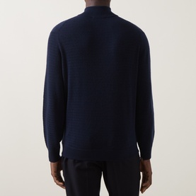 Model wearing Canali navy wool-cashmere half zip jumper, shown from the back with textured knit detail.