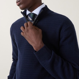 Model wearing Canali navy wool-cashmere half zip jumper, styled with a white shirt and striped tie