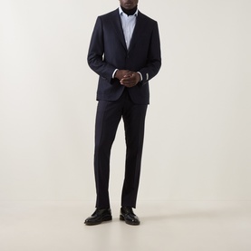 Model wearing Canali D6 Calvary Twill Suit Jacket in navy, single-breasted with notch lapel, styled with matching trousers and black loafers