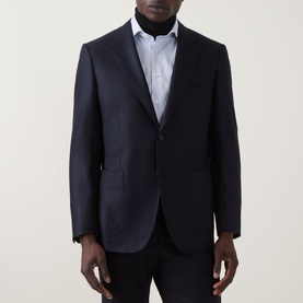 Model wearing Canali D6 Calvary Twill Suit Jacket in navy, single-breasted with notch lapel, styled with white shirt and navy trousers.
