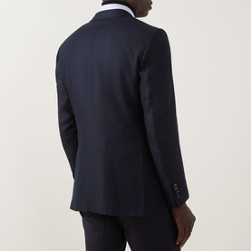 Model wearing Canali D6 Calvary Twill Suit Jacket in navy, rear view showing vented back, buttoned cuffs, and white shirt collar visible.