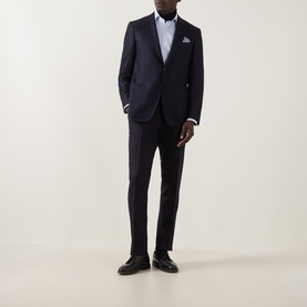 Model wearing Canali D6 Calvary Twill Suit Jacket in navy, single-breasted notch lapel, styled with matching trousers, white shirt and dark oxford