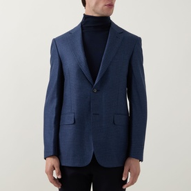 Model wearing Canali dark blue wool-silk blend blazer with subtle texture, styled with a navy roll-neck jumper