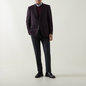Model wearing Canali D6 Check Single-Breasted Blazer in burgundy with grey trousers and black loafers.