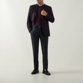 Model wearing Canali D6 Check Single-Breasted Blazer in burgundy with grey trousers, burgundy knit, blue shirt and black shoes.