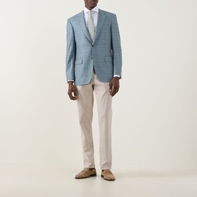 Model wearing Canali D6 Textured Single-Breasted Suit Jacket in mint check, styled with white shirt, beige trousers and tan suede shoes