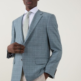Model wearing Canali D6 Textured Single-Breasted Suit Jacket in mint, styled with white shirt and patterned tie