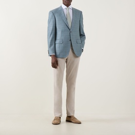 Model wearing Canali D6 Textured Single-Breasted Suit Jacket in mint with cream trousers and tan suede loafers.