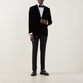 Model wearing Canali D6 Velvet Single-Breasted Suit Jacket in black, styled with dark trousers, bow tie and loafers.