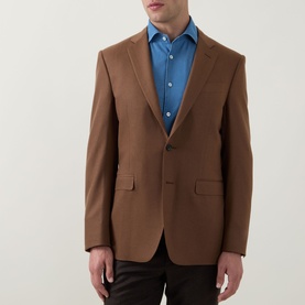 Model wearing Canali Flannel Single-Breasted Blazer in camel, notch lapel, styled with a blue shirt and dark trousers