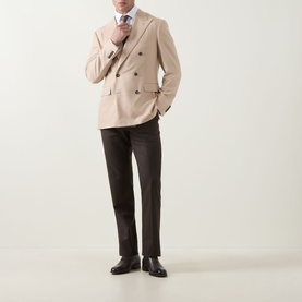 Model wearing Canali D8 Double-Breasted Blazer in navy, peak lapels, styled with dark trousers and black leather shoes.