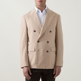 Model wearing Canali D8 Double-Breasted Blazer in navy, peak lapels, flap pockets, brown buttons, styled with white shirt and dark trousers.